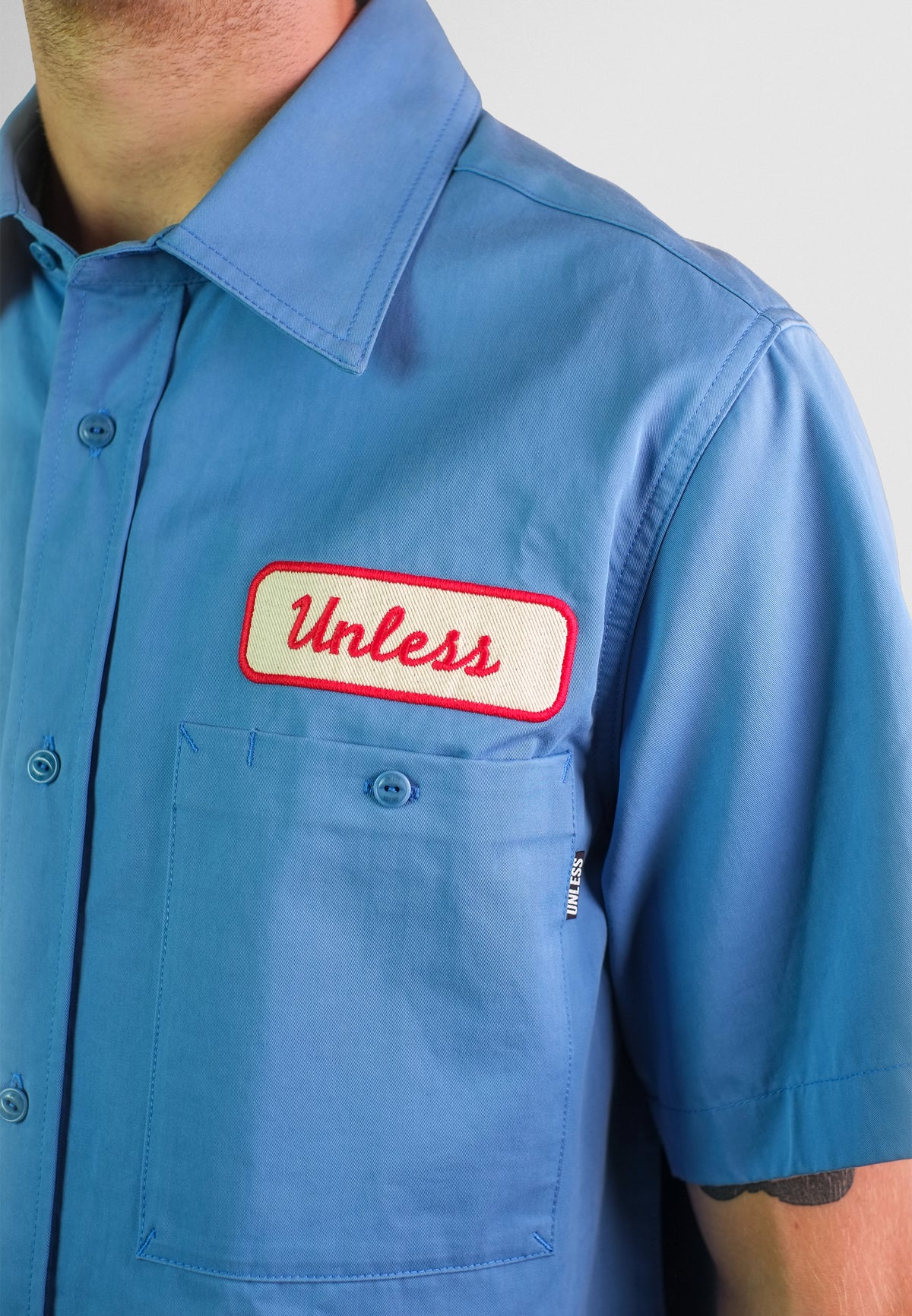 "UNLESS" Embroidered Work Shirt